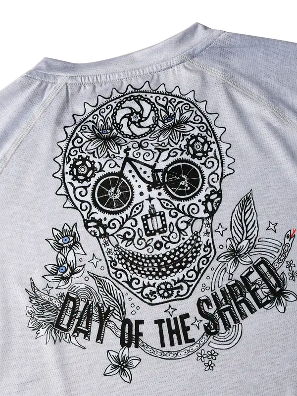 Day of The Shred Grey Women's Short Sleeve MTB Jersey with a black skull design and 'Day of the Shred' text on the back 